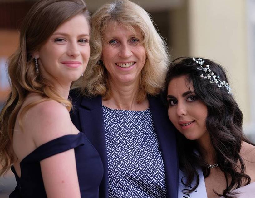 Mrs Morgan with Year 12 graduates she taught in Year 6
