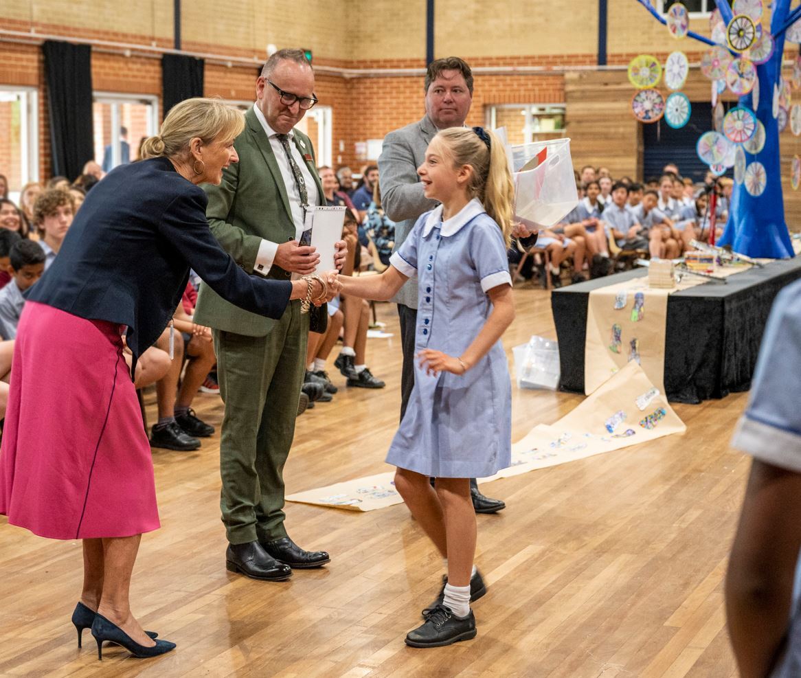 Principal Fiona Godfrey presents an award to Ana Mann at Year 6 Celebration.