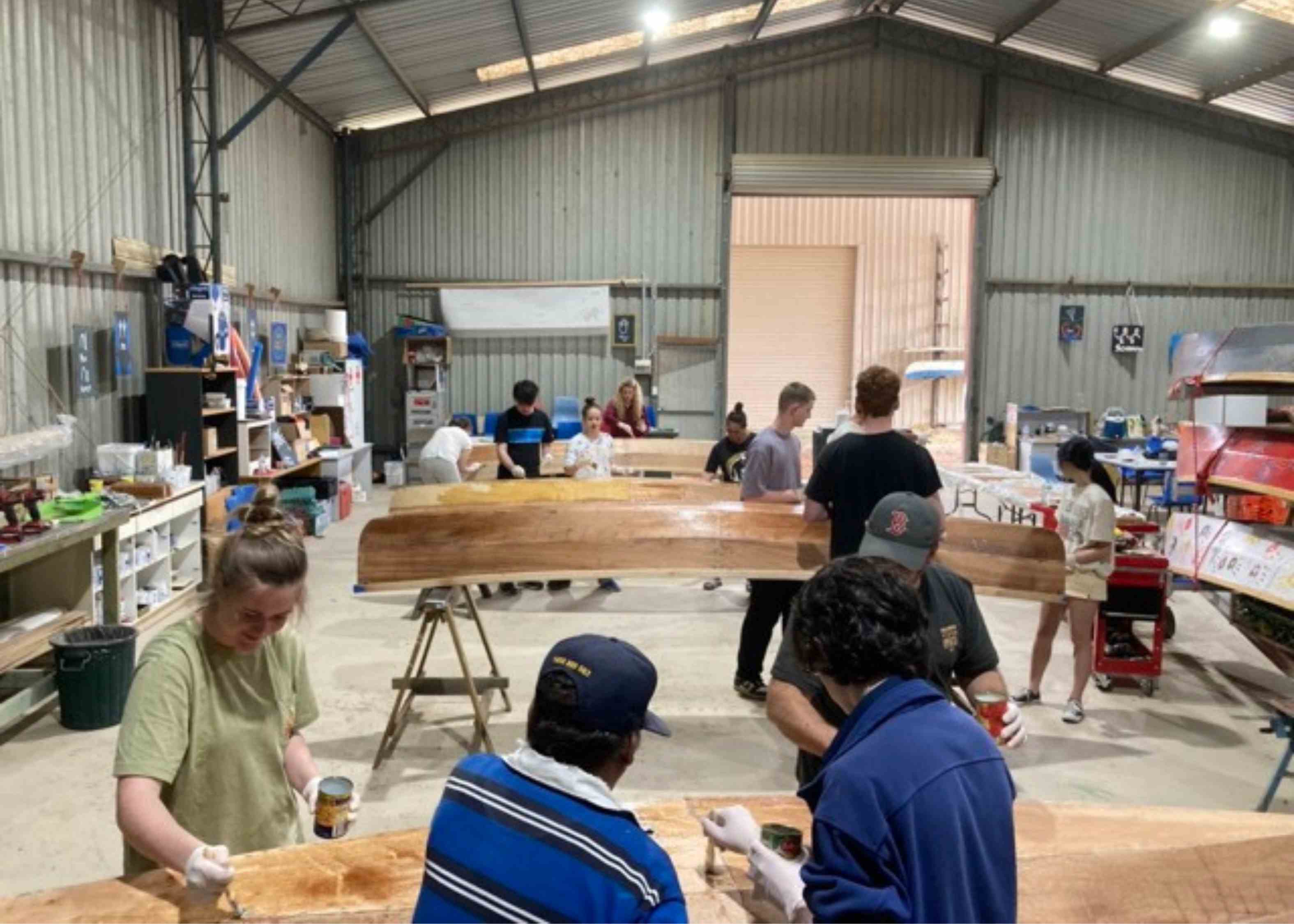 Students building the canoes at the Eden Canoes project.