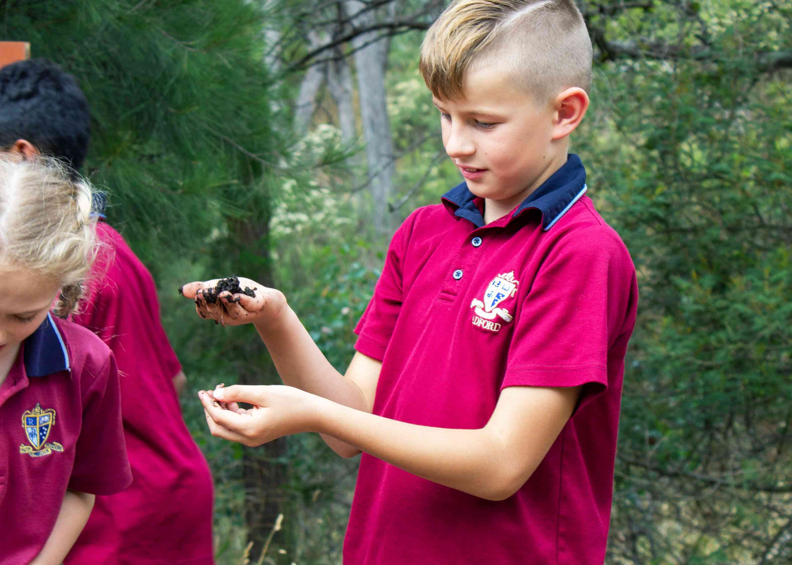George Dankiw and Livvy Losanno explore the worm farm.