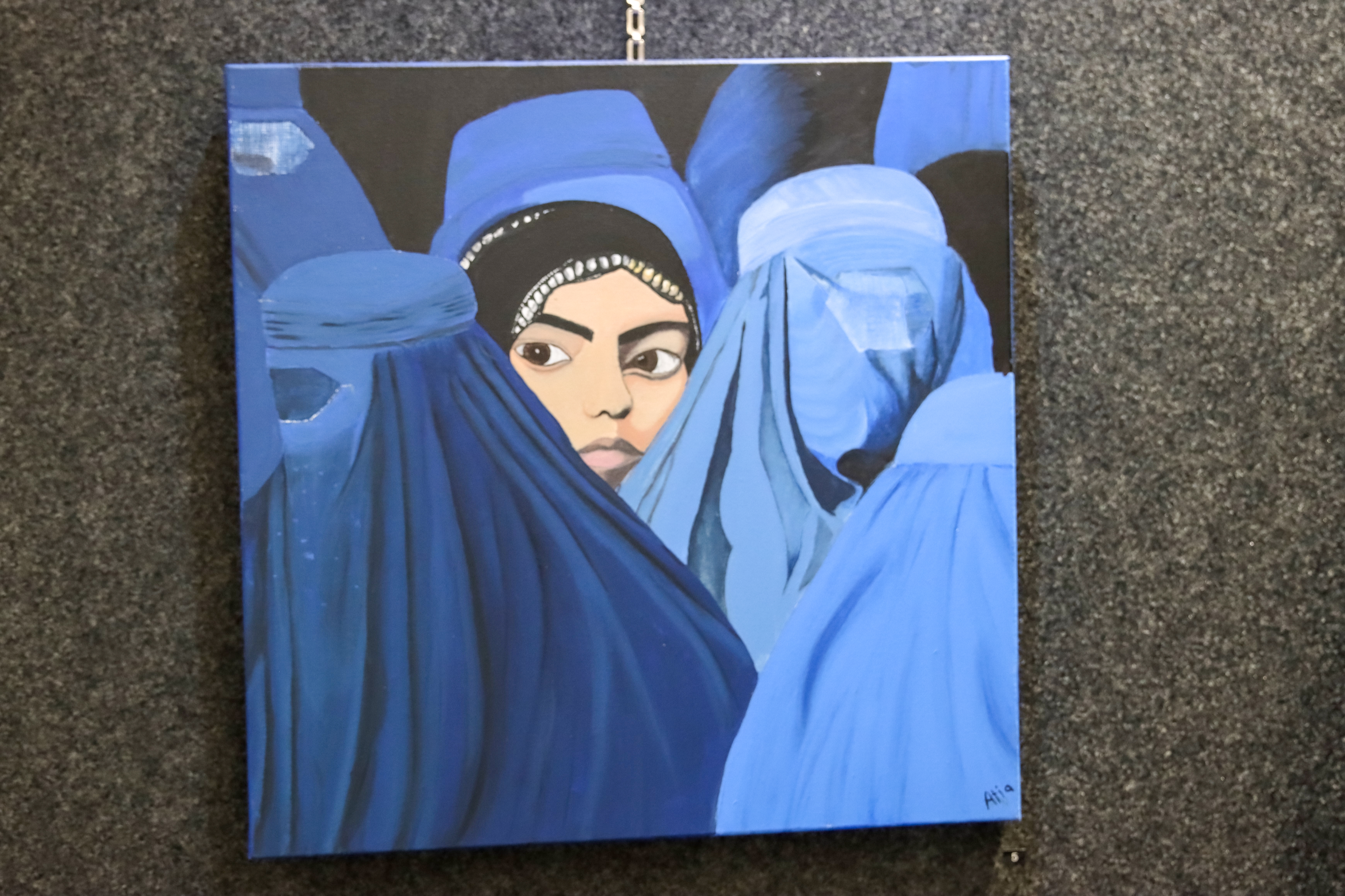 A student receiving an award for their art