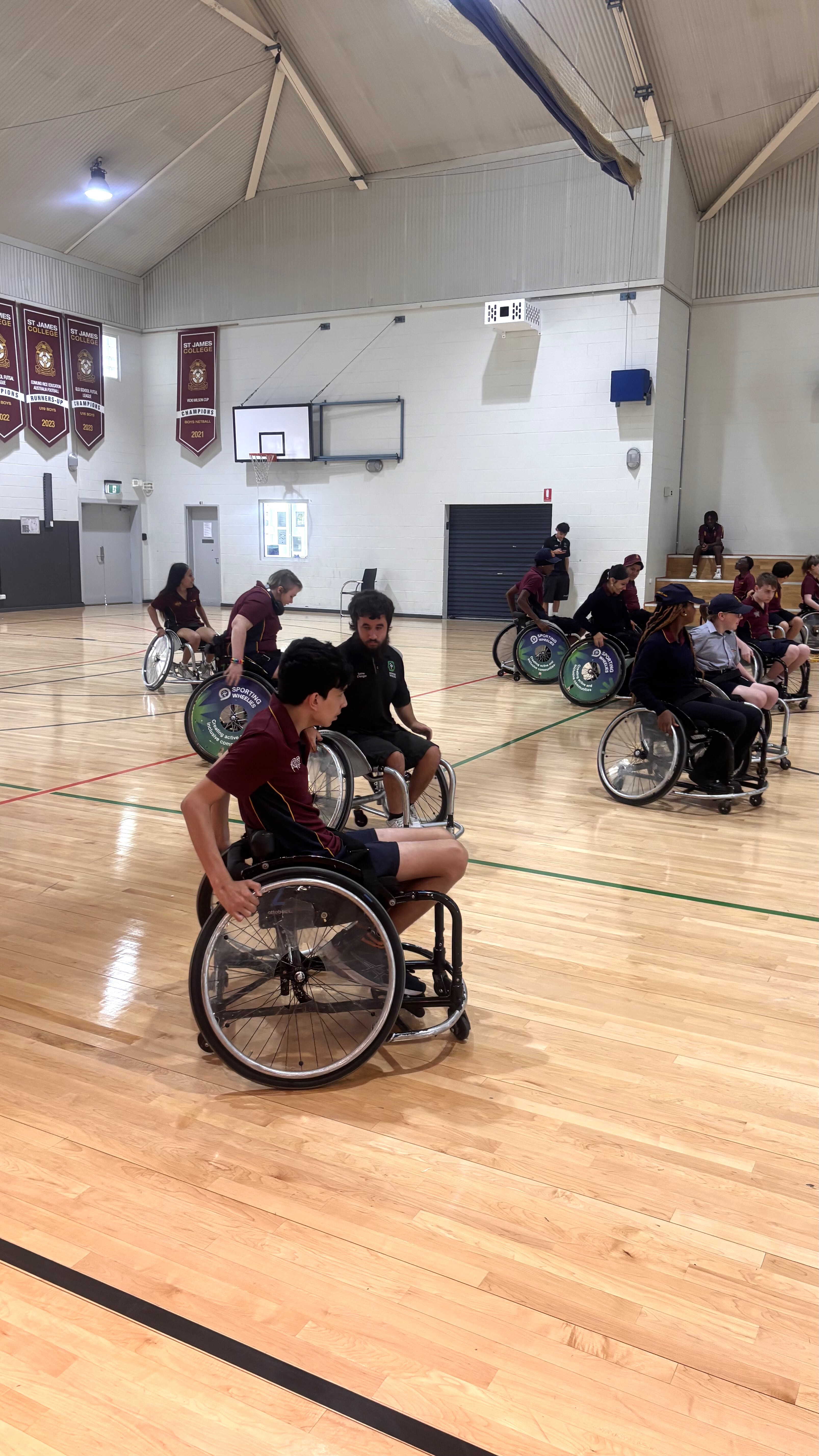 Students learning to play wheelchair basketball