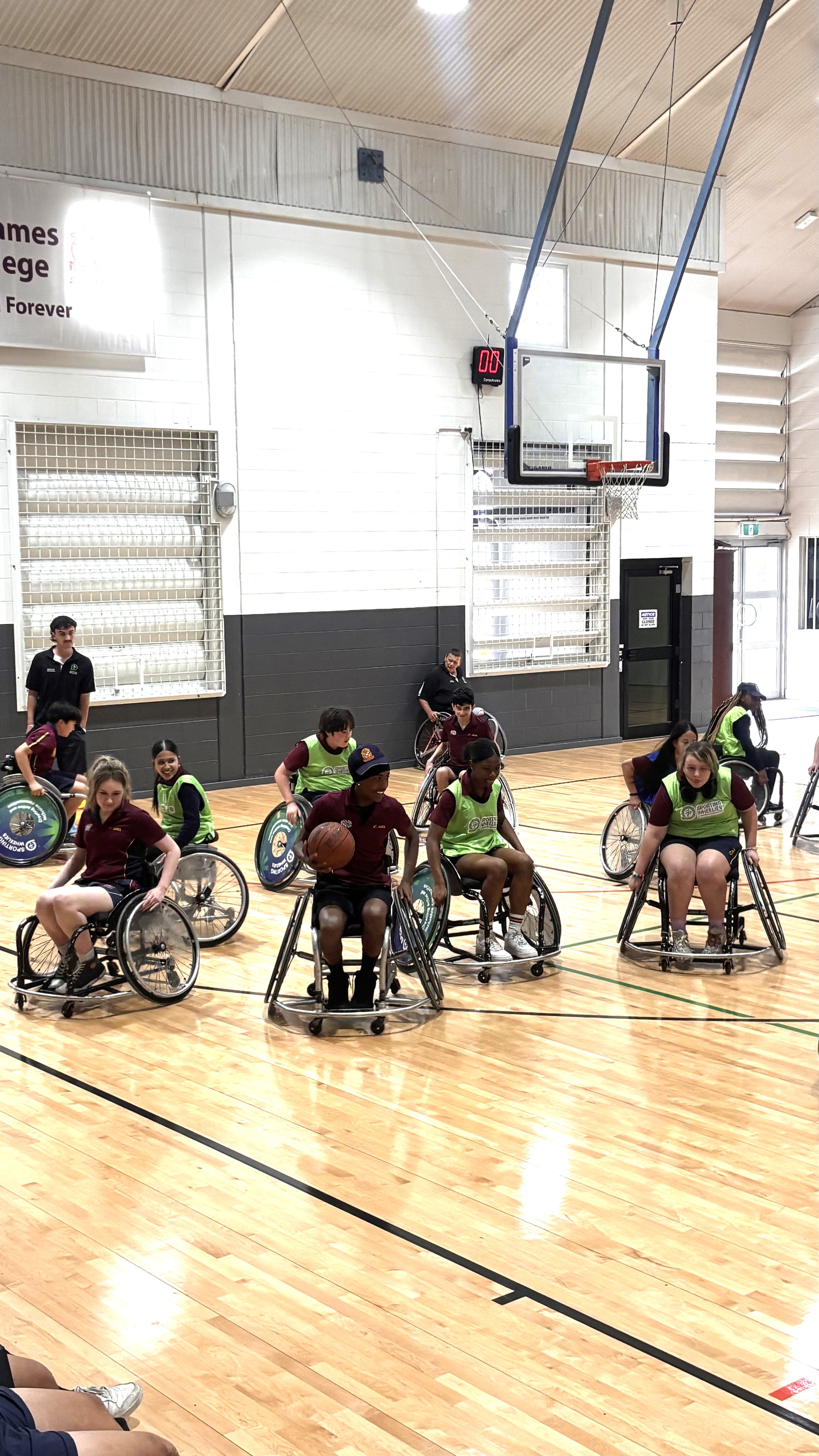 Students experiencing wheelchair sports firsthand