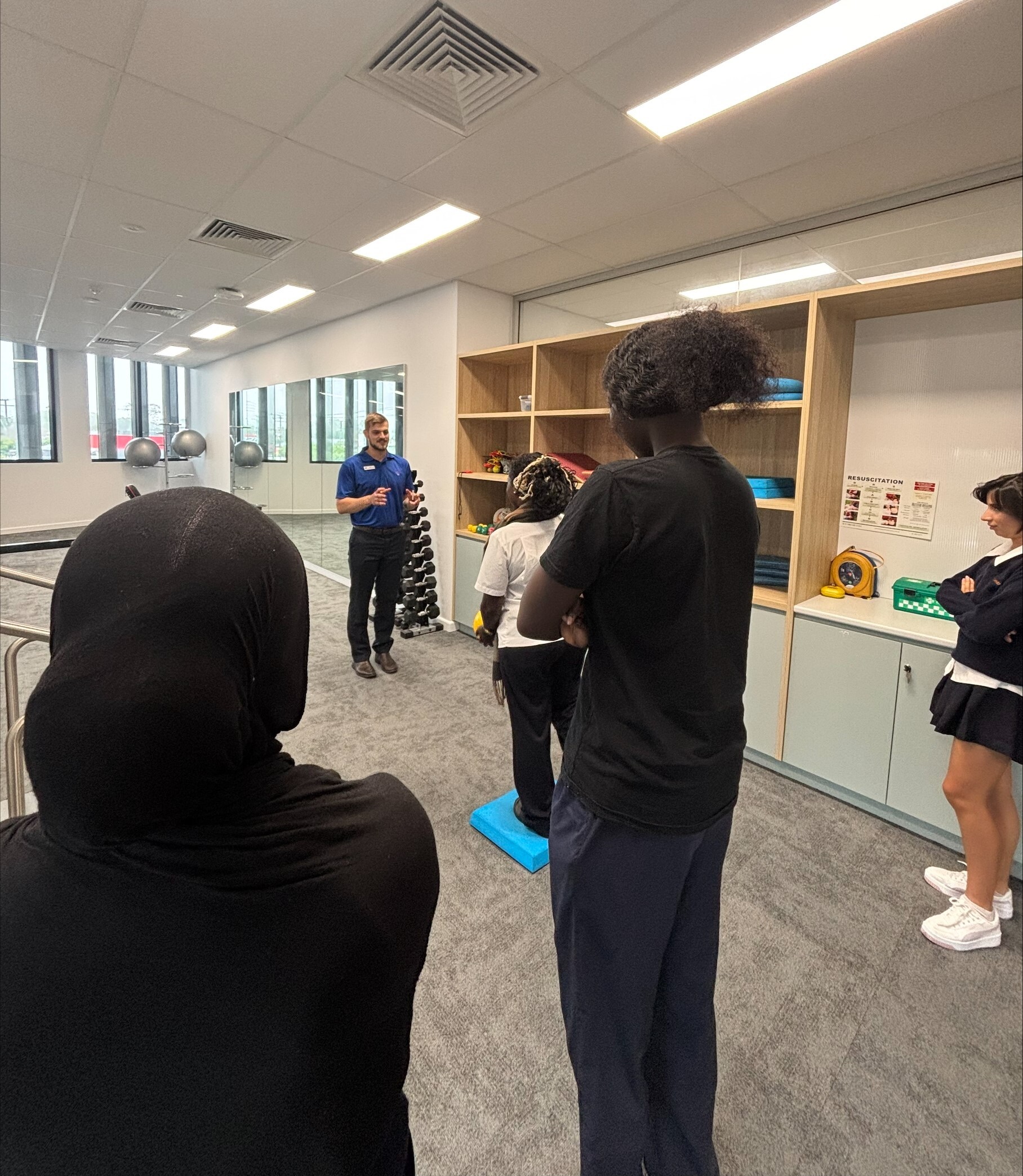 Students engaging with health professionals during the excursion