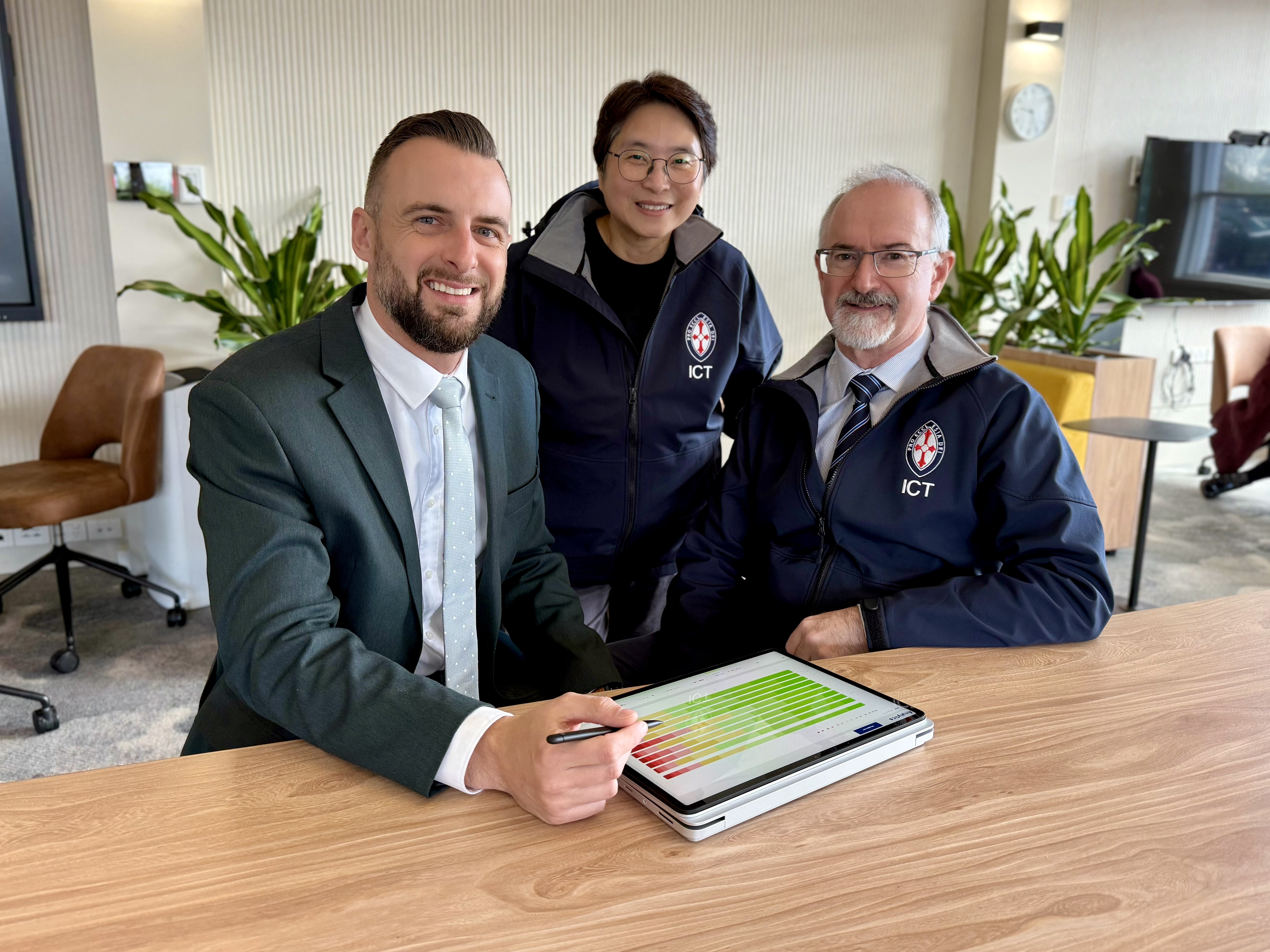 St Michael's ICT team pose for a photo in their office