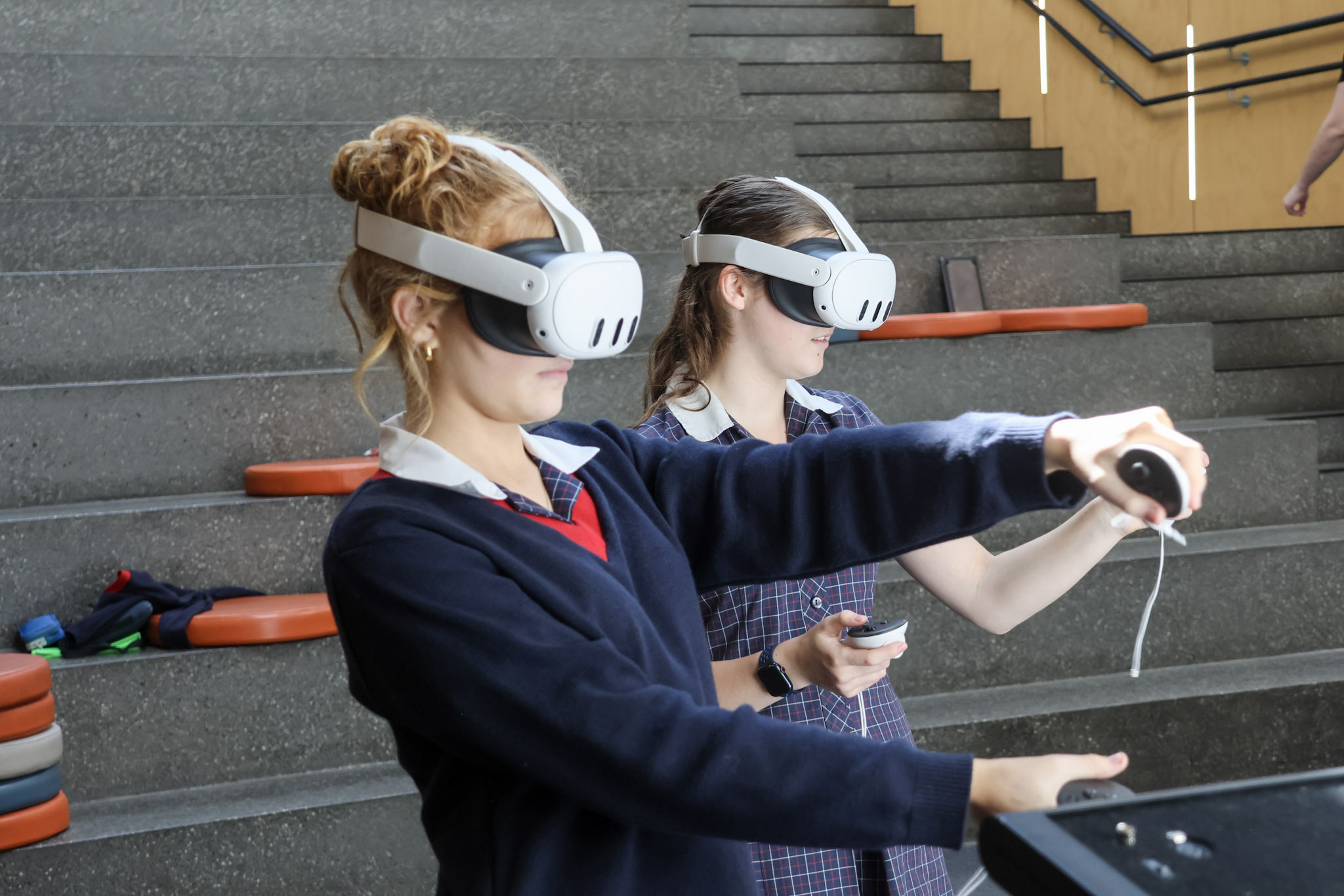 two st michael's students simulate a driving test with VR goggles on